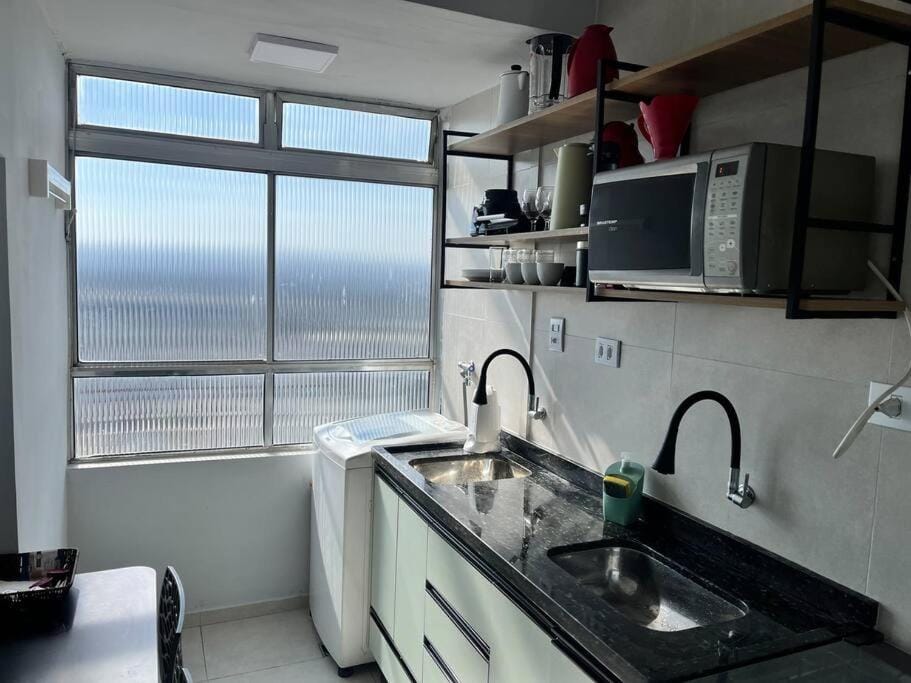 Kitchen or kitchenette, microwave, stove, laundry