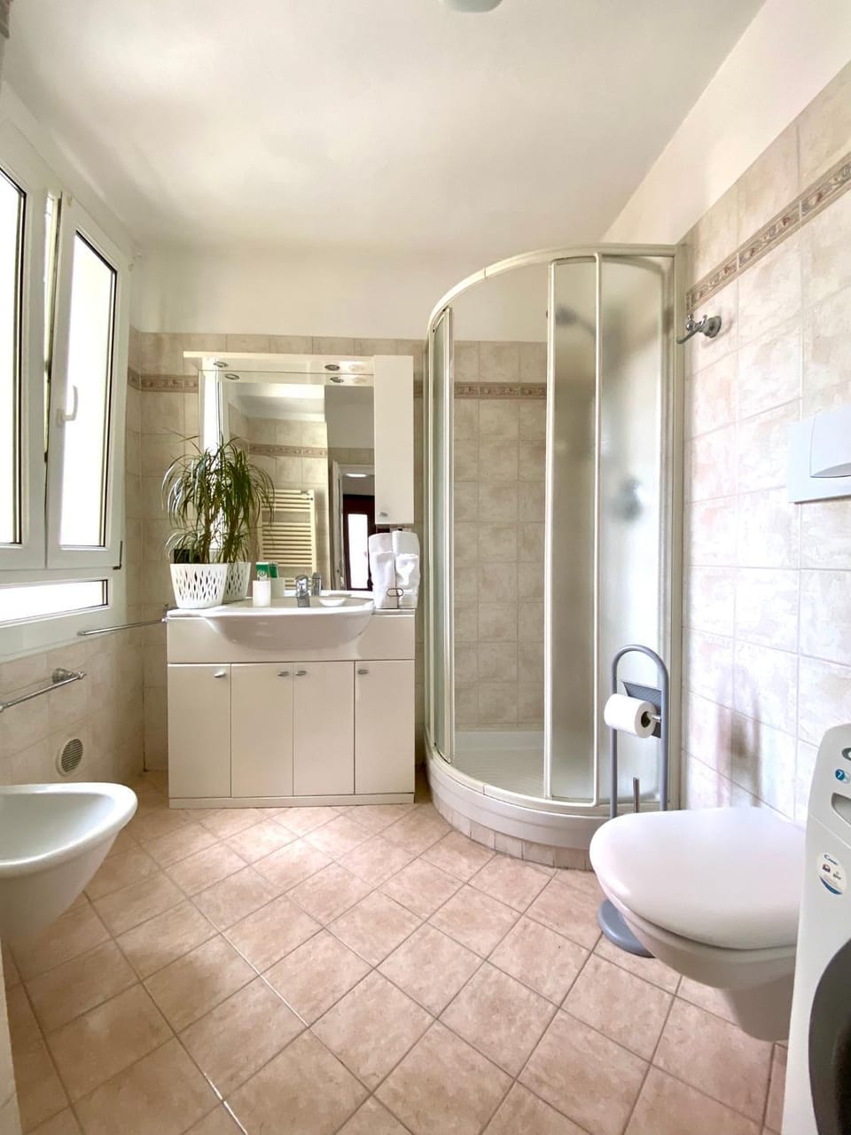 Shower, Toilet, Bathroom, bidet, towels, washing machine, dryer
