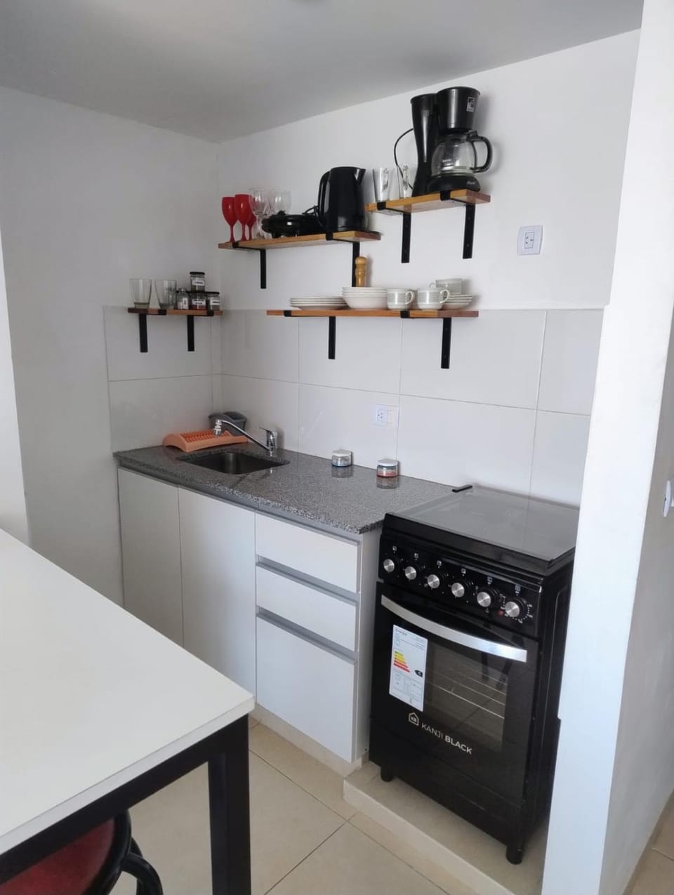Kitchen or kitchenette, stove, toaster