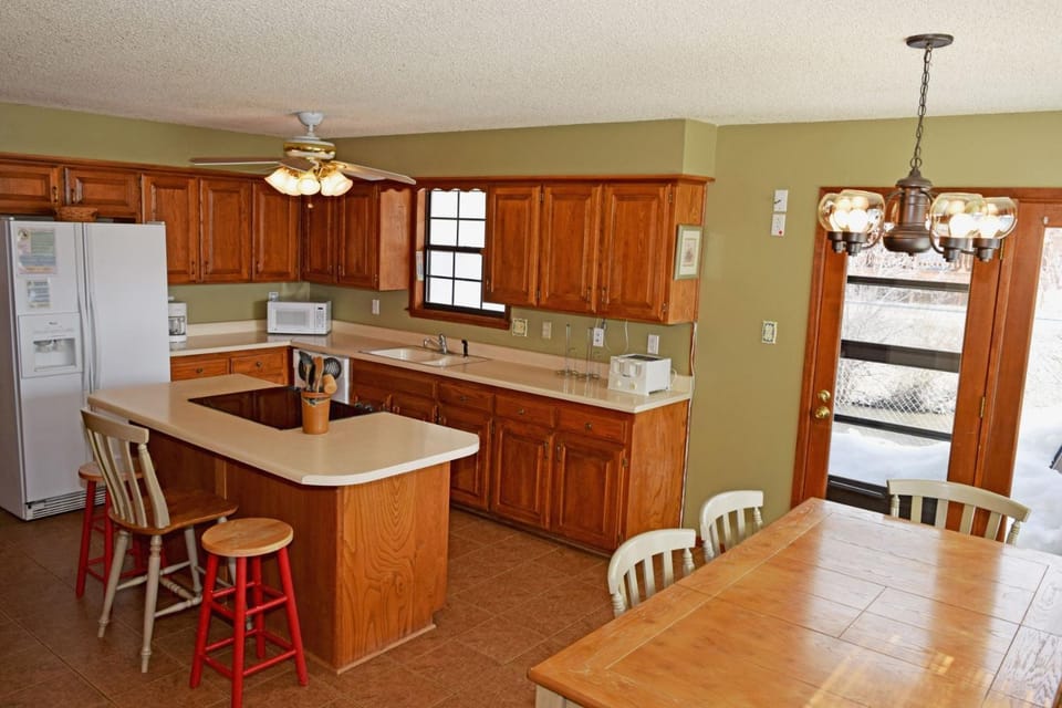 Kitchen or kitchenette, Dining area, furniture, microwave, kitchen