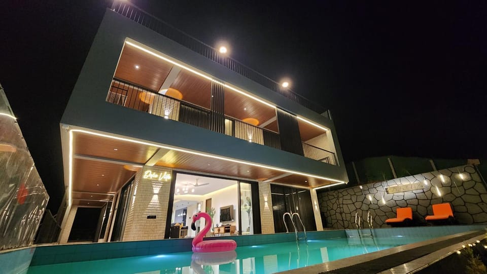 Property building, Patio, Night, Pool view, Swimming pool, sunbed