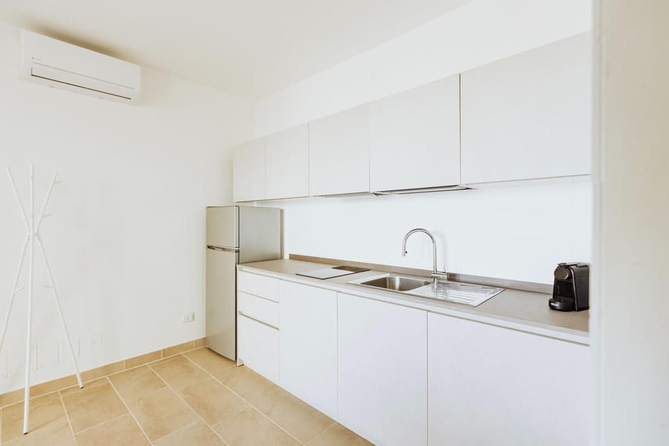 Kitchen or kitchenette, stove, air conditioner
