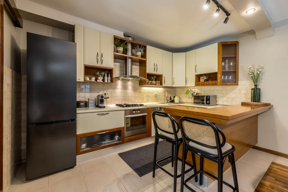 Kitchen or kitchenette, dishwasher, oven, stove, toaster