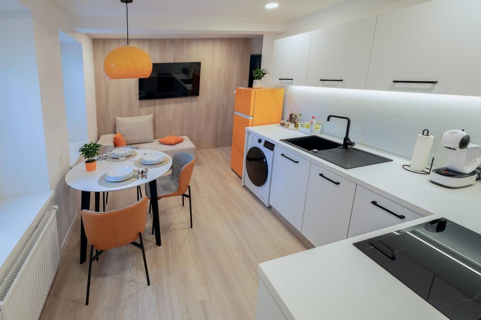 Living room, Dining area, dishwasher, oven, stove, washing machine, dryer, kitchen