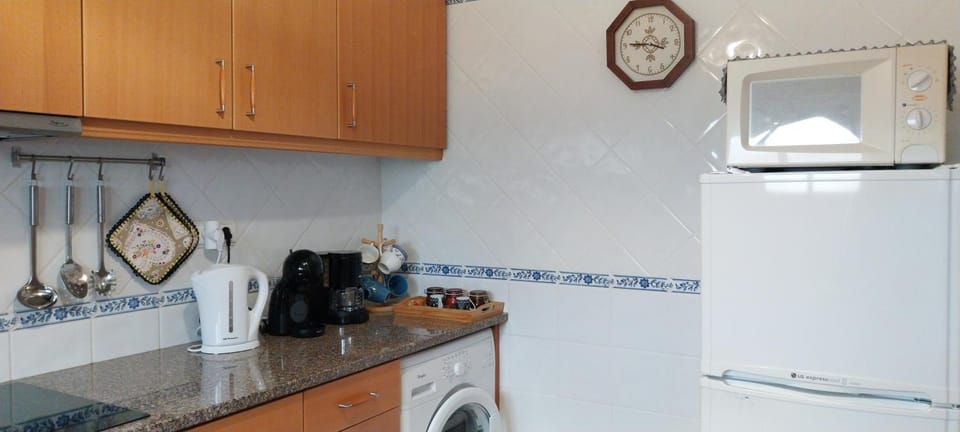 Kitchen or kitchenette, washing machine