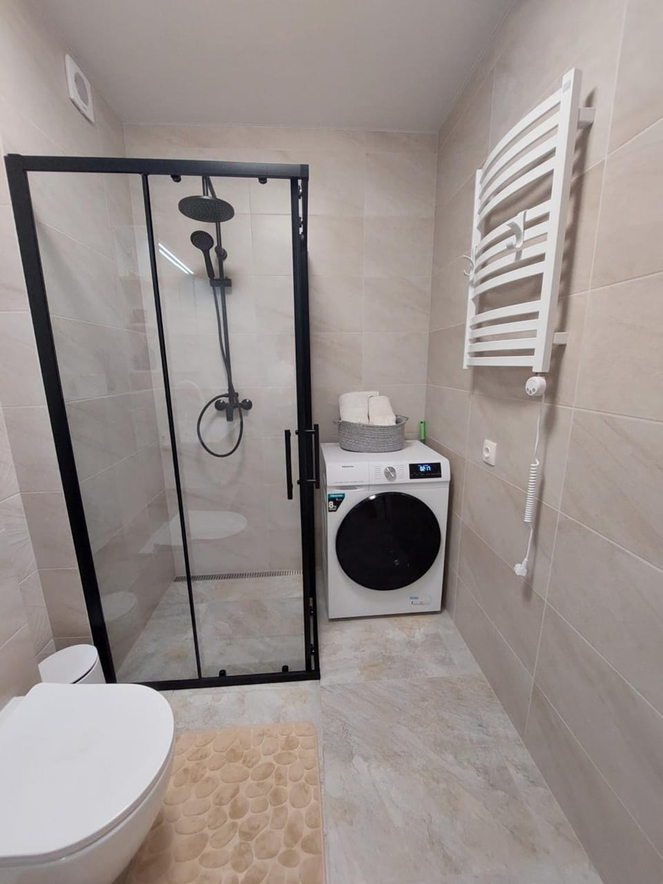 Shower, Toilet, towels, washing machine