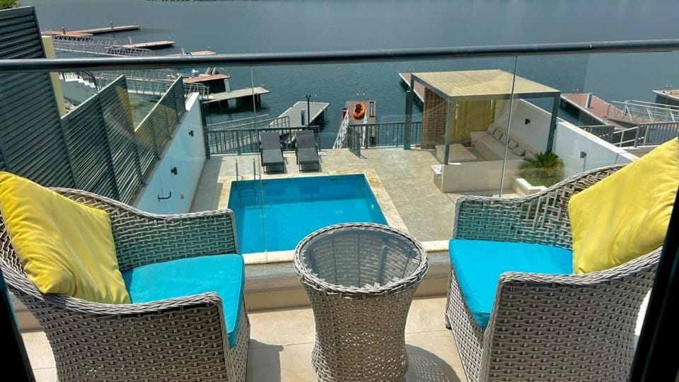 Patio, Day, View (from property/room), Balcony/Terrace, Living room, Seating area, Pool view, Swimming pool, sunbed