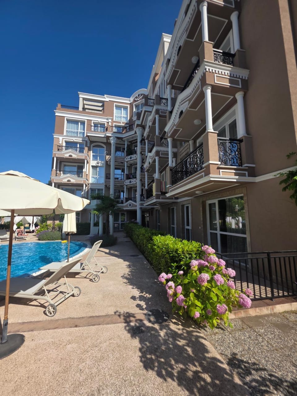 Property building, Patio, Swimming pool, sunbed