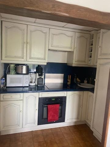 Kitchen or kitchenette, stove, toaster