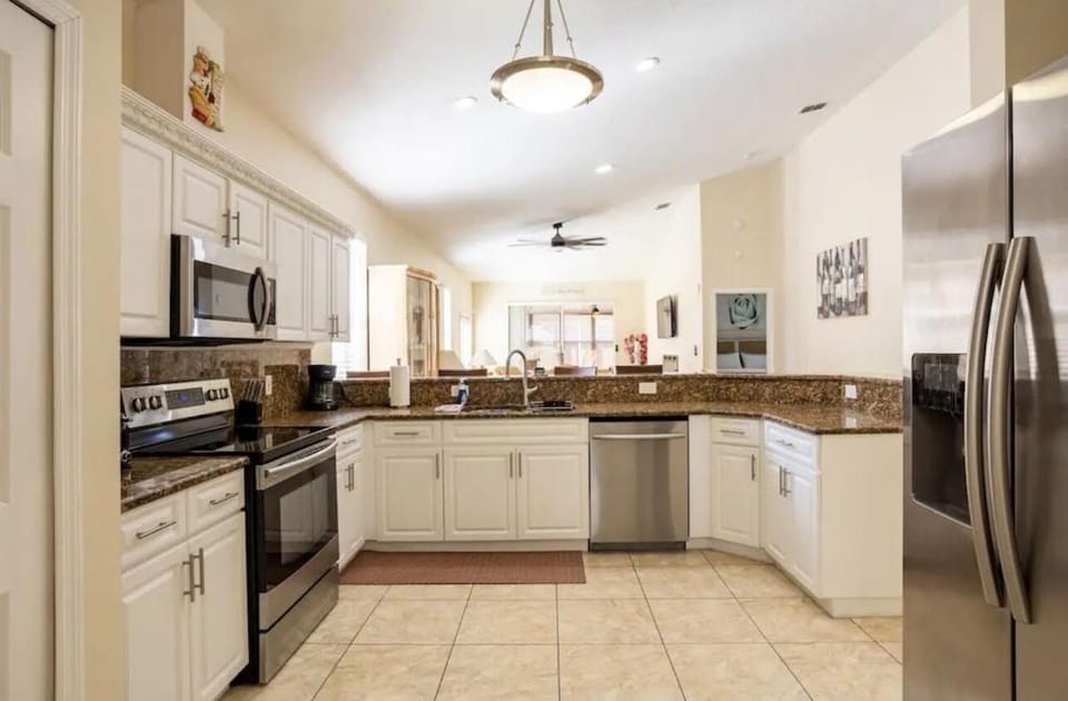 Kitchen or kitchenette, dishwasher, oven, stove