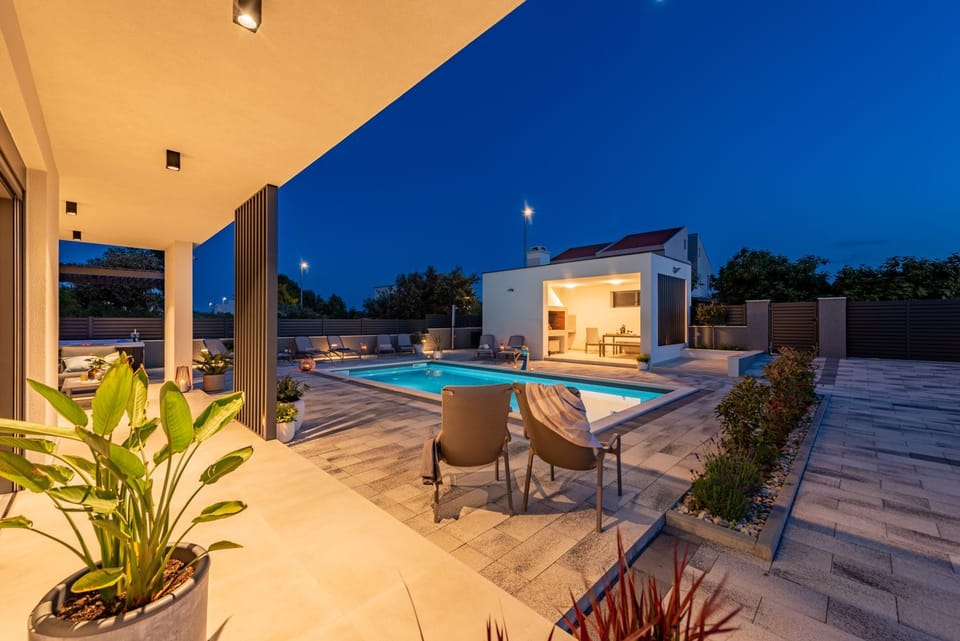 Property building, Night, Pool view, Swimming pool, sunbed