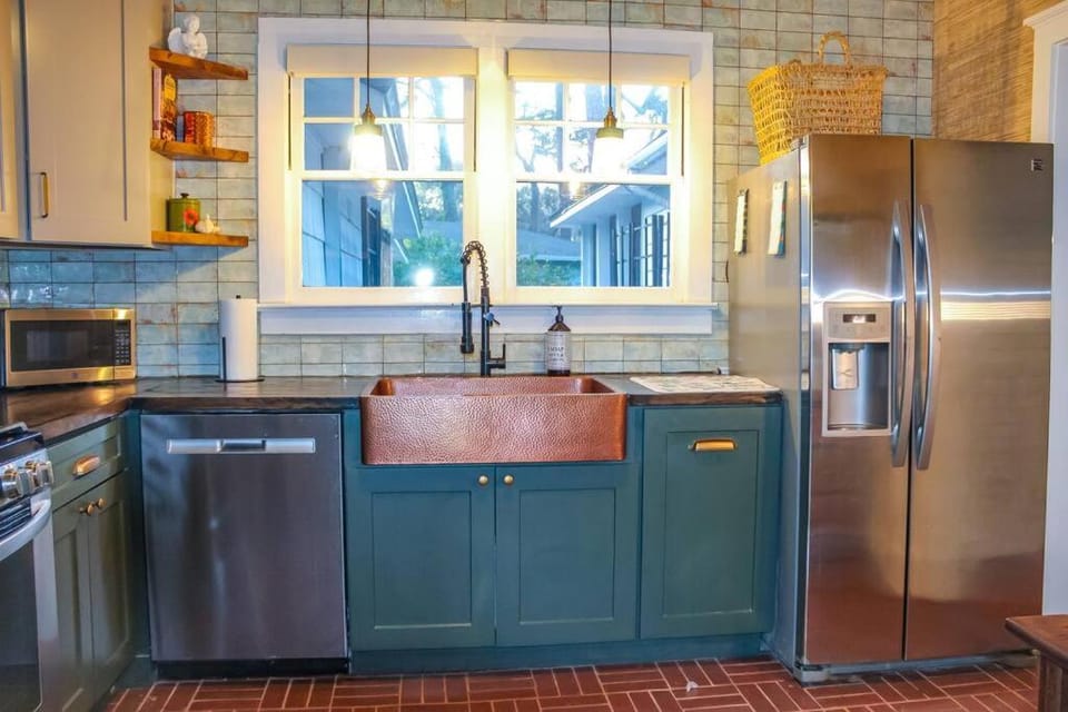 Kitchen or kitchenette, dishwasher, oven, stove