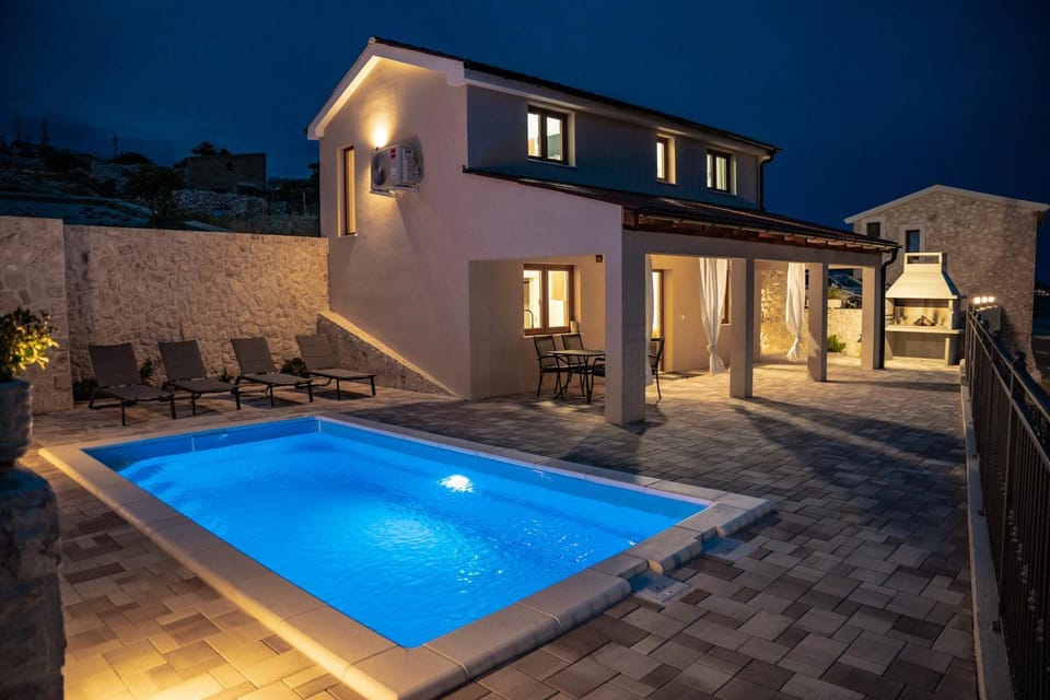 Property building, Patio, Night, Pool view, Swimming pool, sunbed