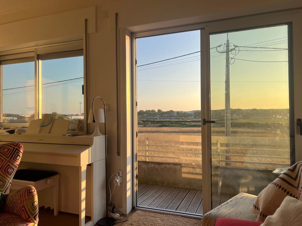 Balcony/Terrace, Living room, Street view, Sunset