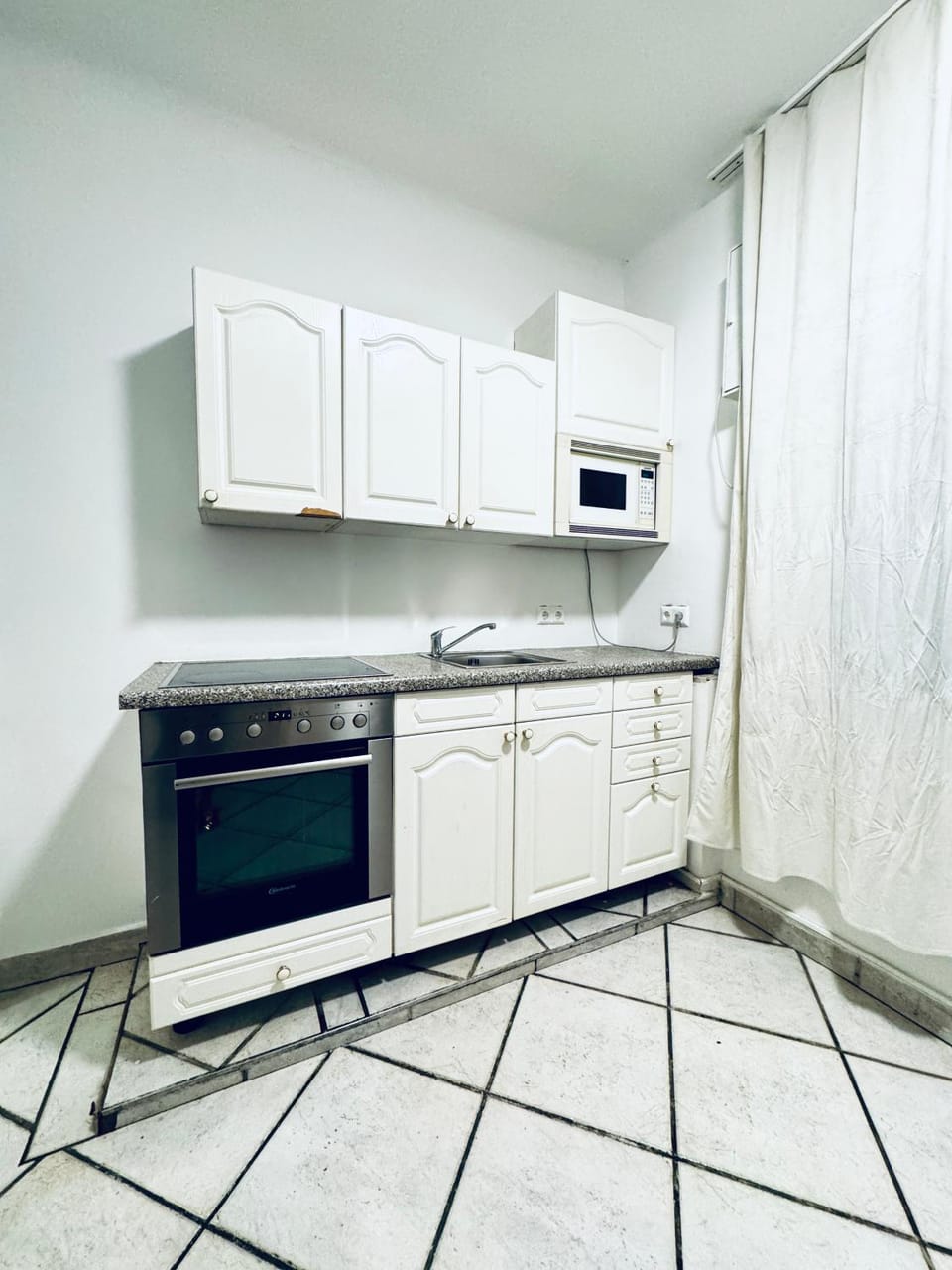 Kitchen or kitchenette, oven, stove