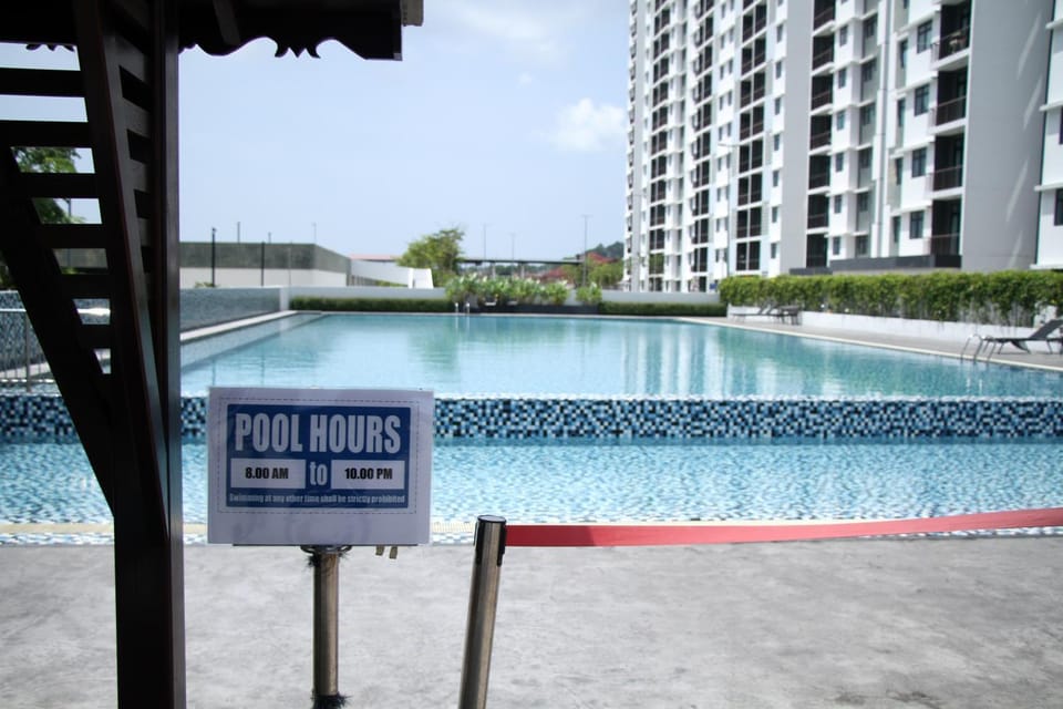 Day, Property logo or sign, Swimming pool