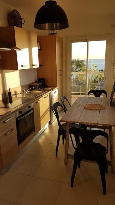 Kitchen or kitchenette, dishwasher, stove, toaster