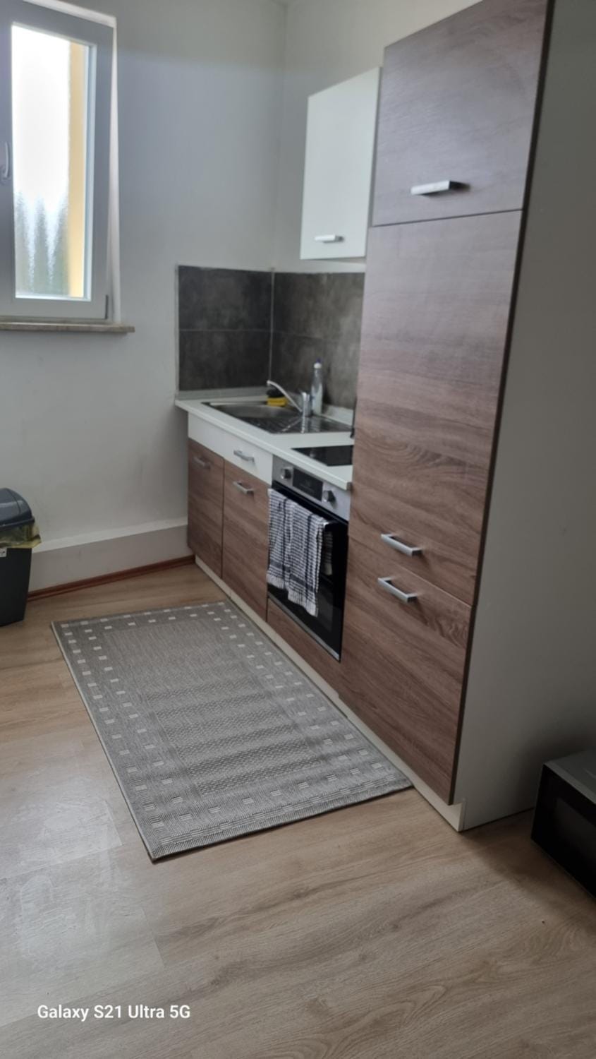 Kitchen or kitchenette, oven, stove