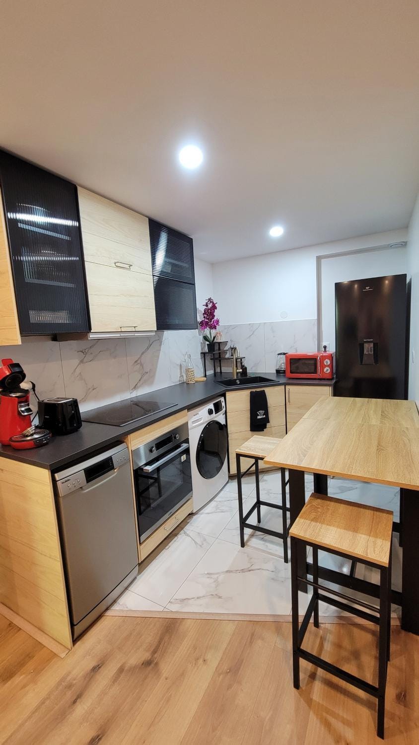 Kitchen or kitchenette, dishwasher, oven, stove, toaster, washing machine, dryer
