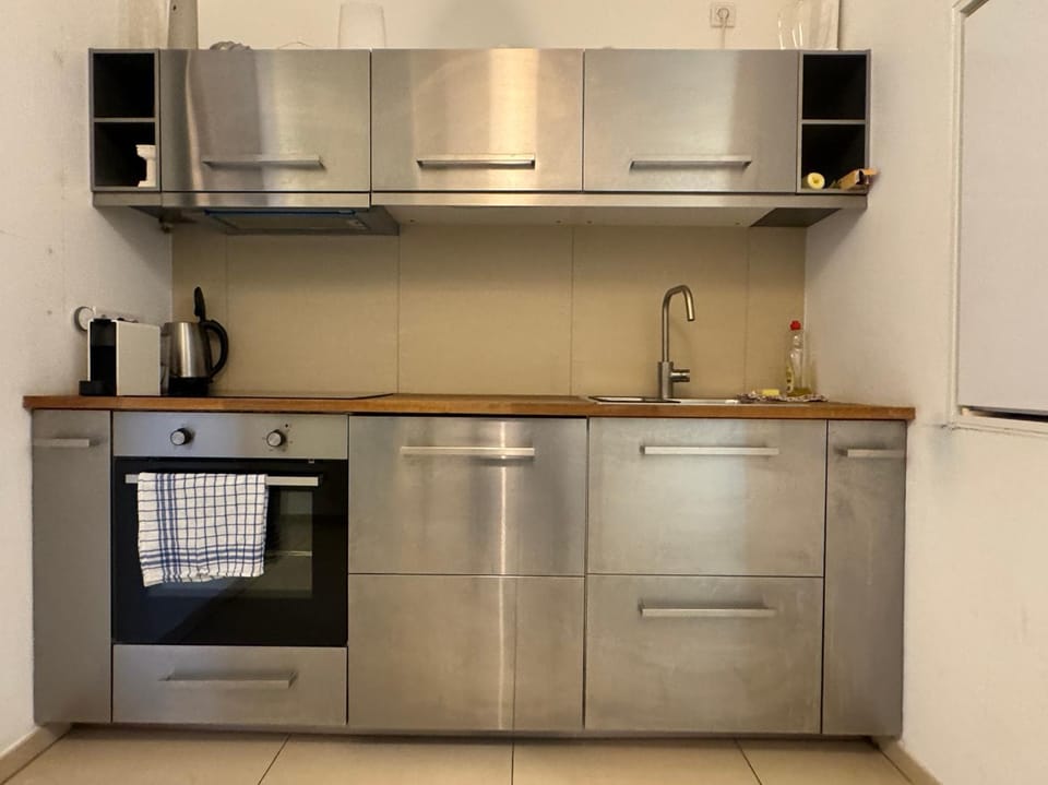 Kitchen or kitchenette, dishwasher, oven, stove