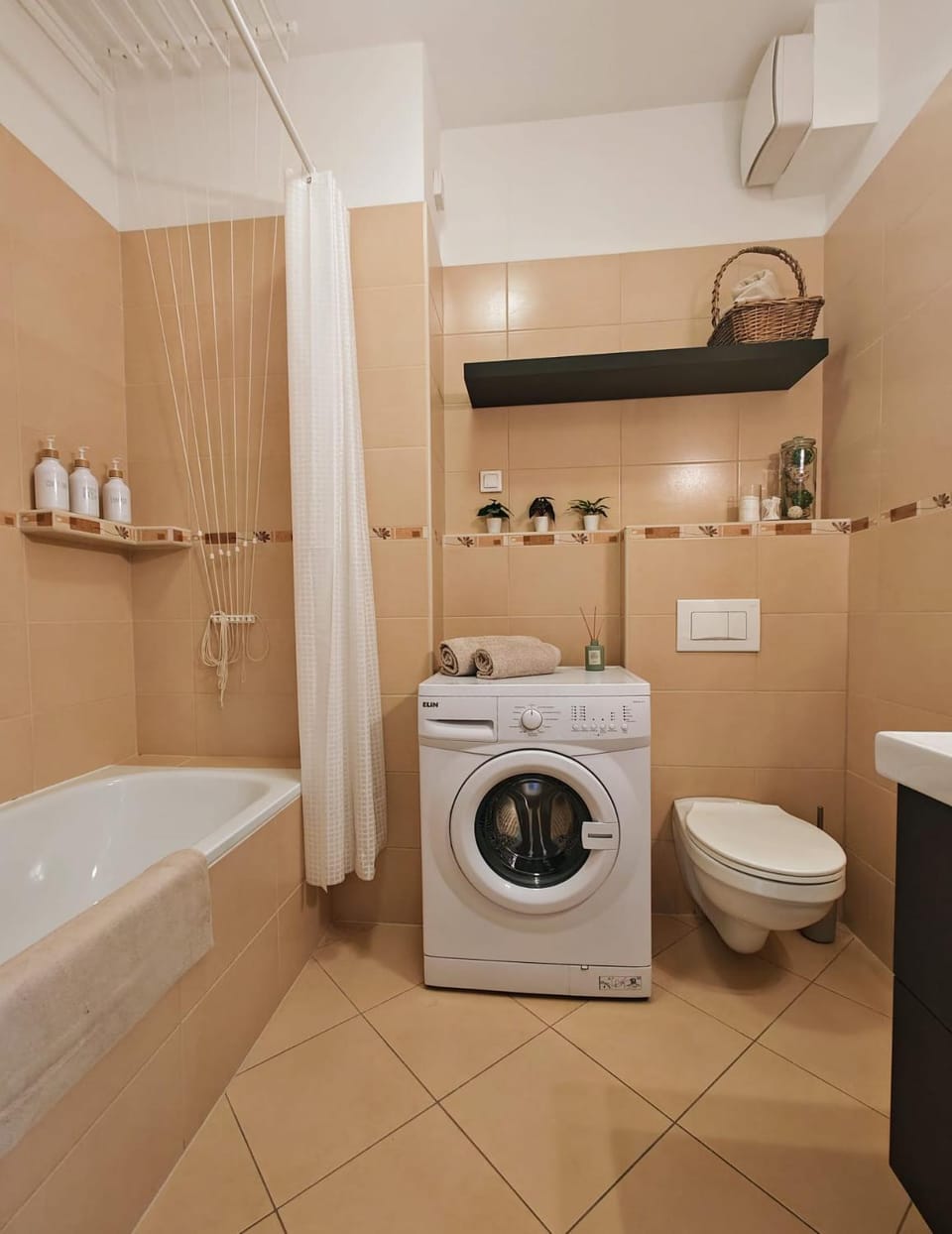 Toilet, Bathroom, Bath, hair dryier, towels, washing machine