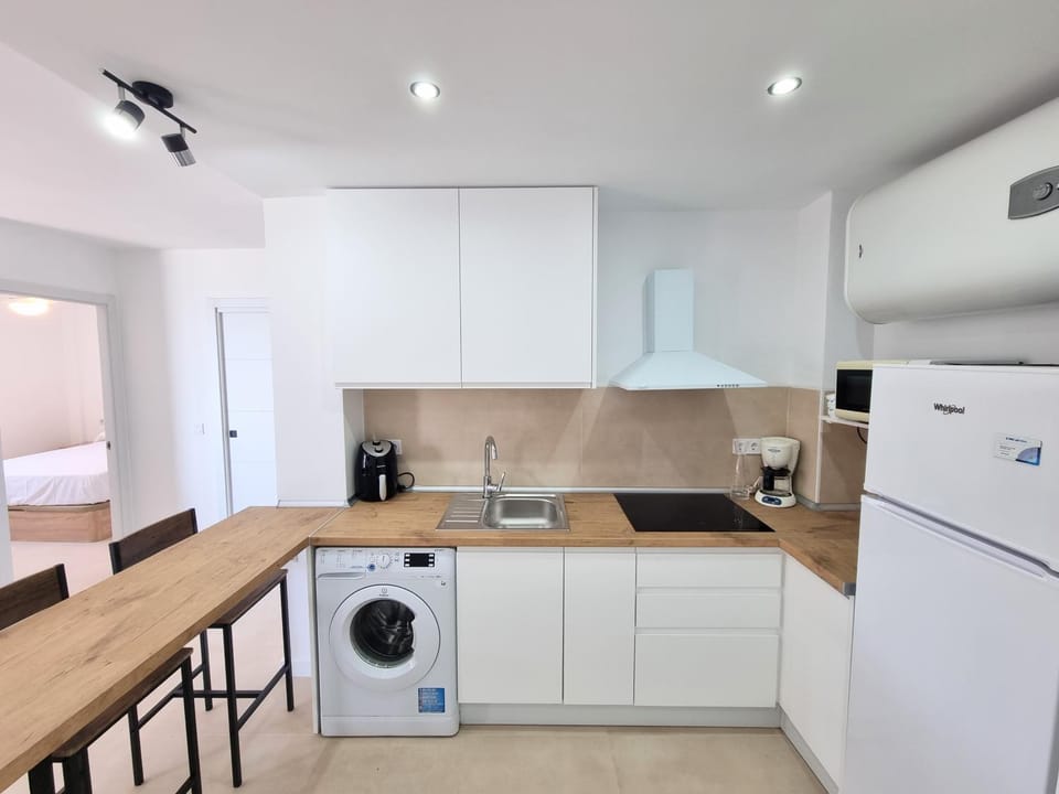 Kitchen or kitchenette, washing machine