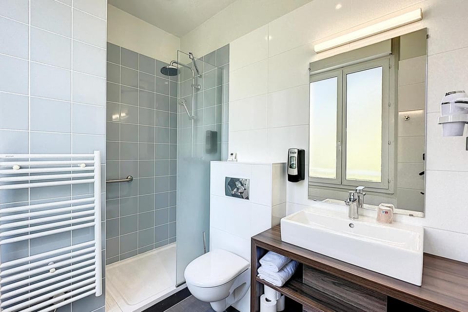 Shower, Toilet, Bathroom, hair dryier, towels