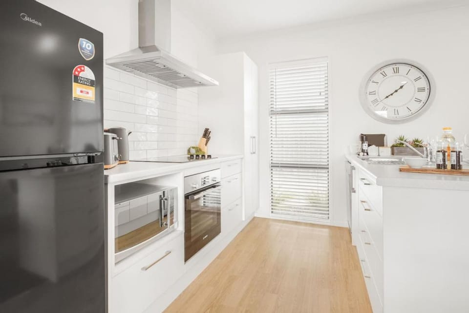 Kitchen or kitchenette, dishwasher, microwave, oven, stove, toaster