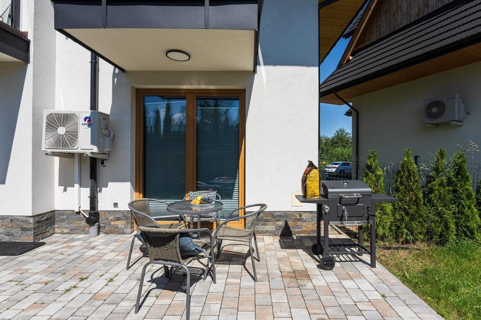 Property building, Patio, Day, View (from property/room), Balcony/Terrace, Living room, Seating area, Dining area
