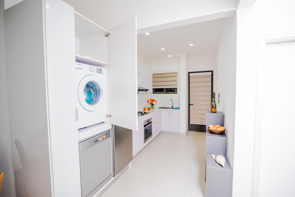 Kitchen or kitchenette, dishwasher, microwave, oven, stove, washing machine, washing machine