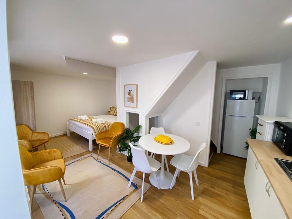 Bed, Kitchen or kitchenette, Seating area