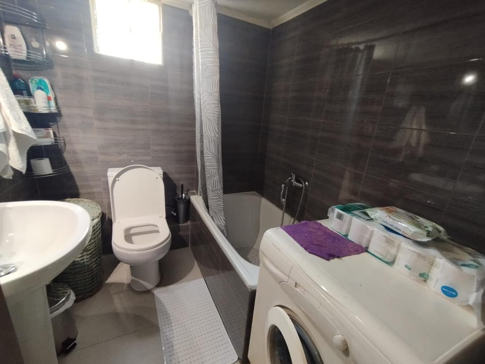 Shower, Toilet, Bathroom, towels, washing machine, dryer
