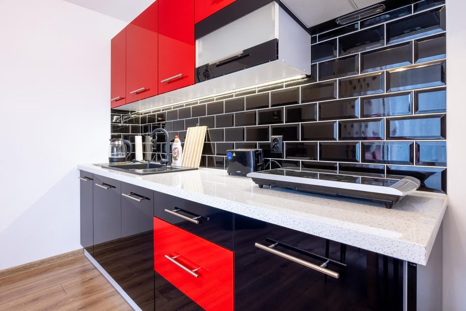 Kitchen or kitchenette, dishwasher, oven, stove