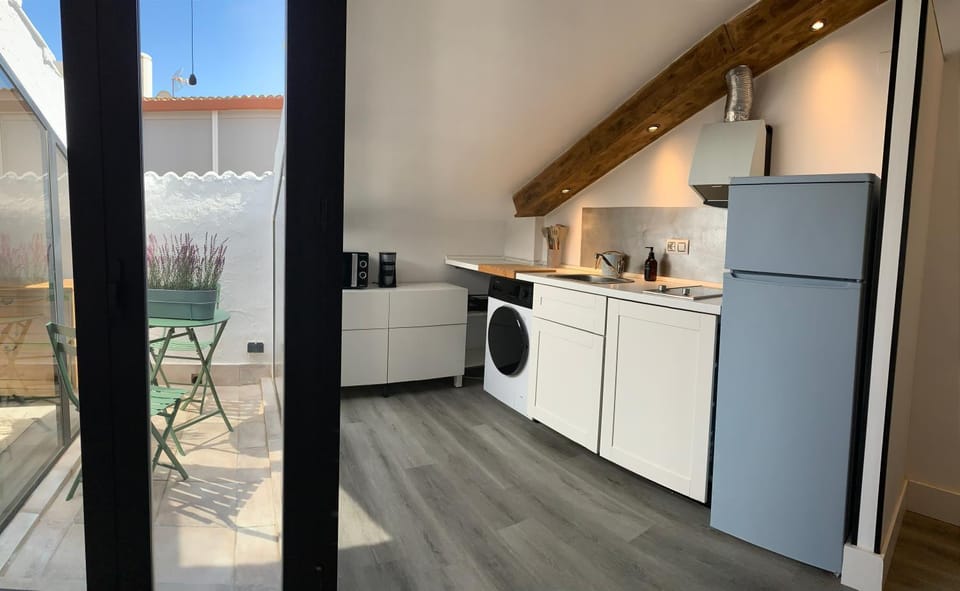 Kitchen or kitchenette, dishwasher, stove, toaster, washing machine