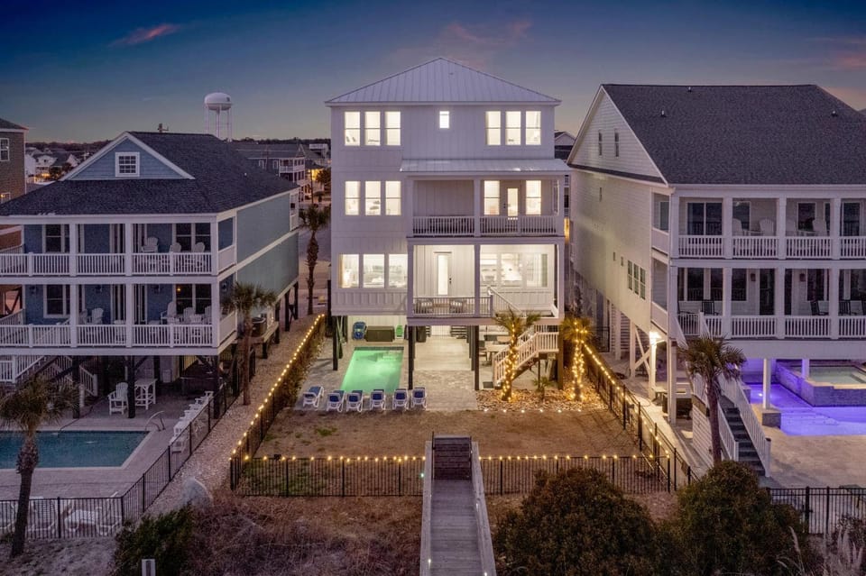 Property building, Patio, Night, Swimming pool, sunbed