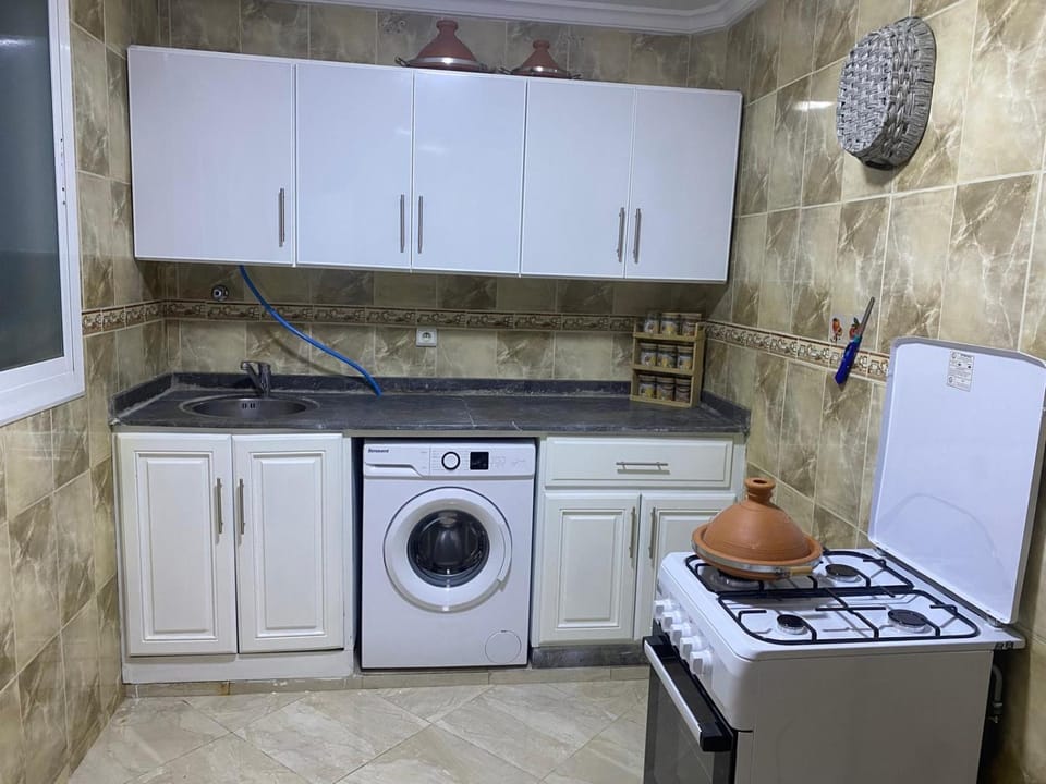 Kitchen or kitchenette, oven, stove, washing machine