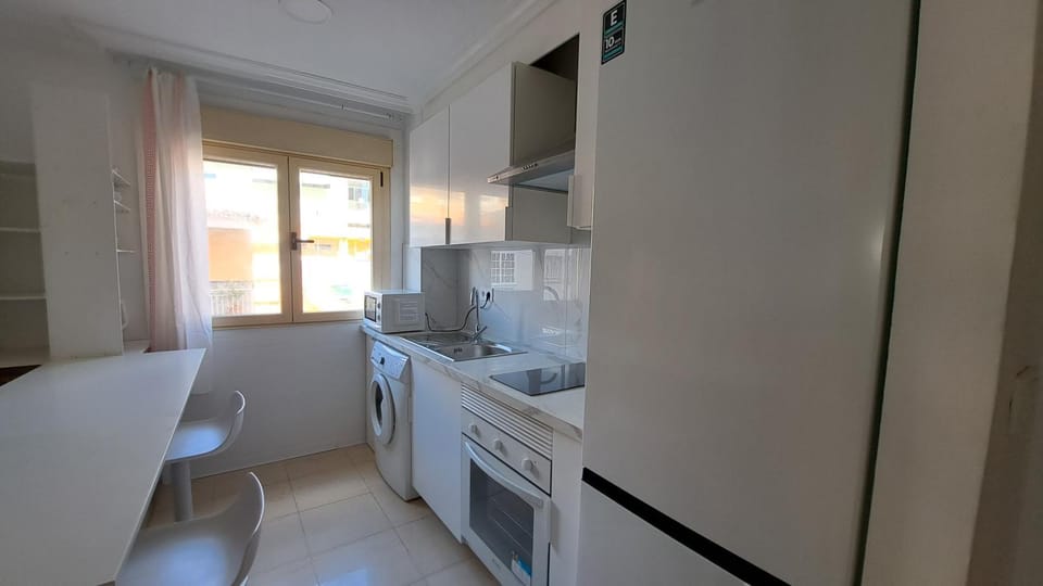 Kitchen or kitchenette, oven, stove, washing machine