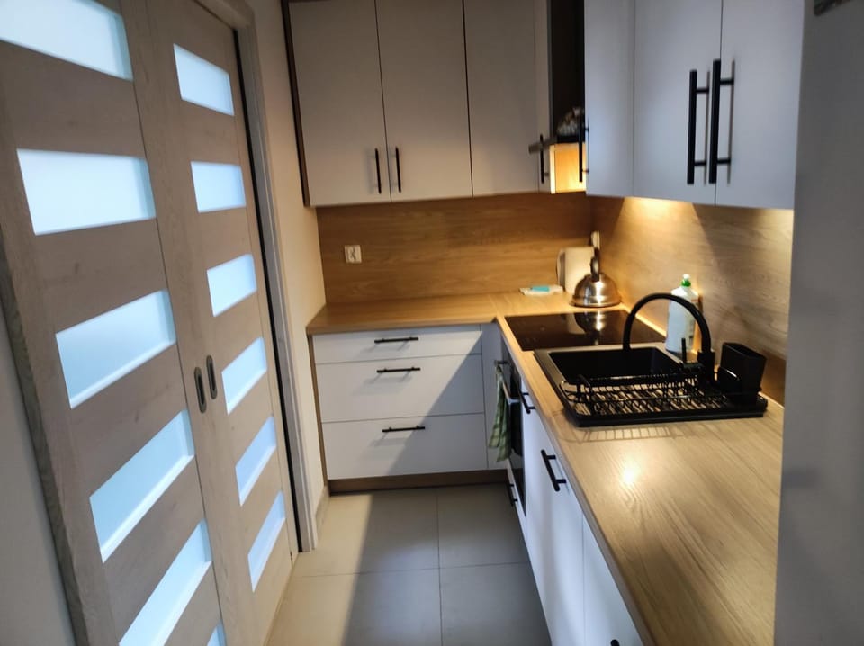 Kitchen or kitchenette, dishwasher, stove, washing machine