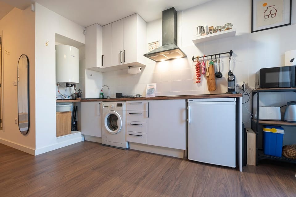Kitchen or kitchenette, dishwasher, stove, toaster, washing machine