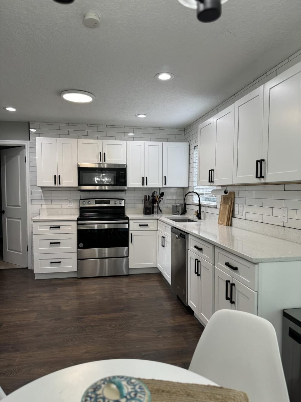 Kitchen or kitchenette, dishwasher, oven, stove, toaster