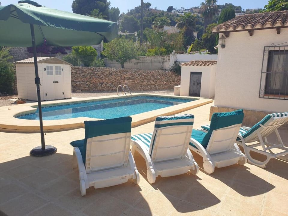 Patio, Day, Seating area, Pool view, Swimming pool, sunbed