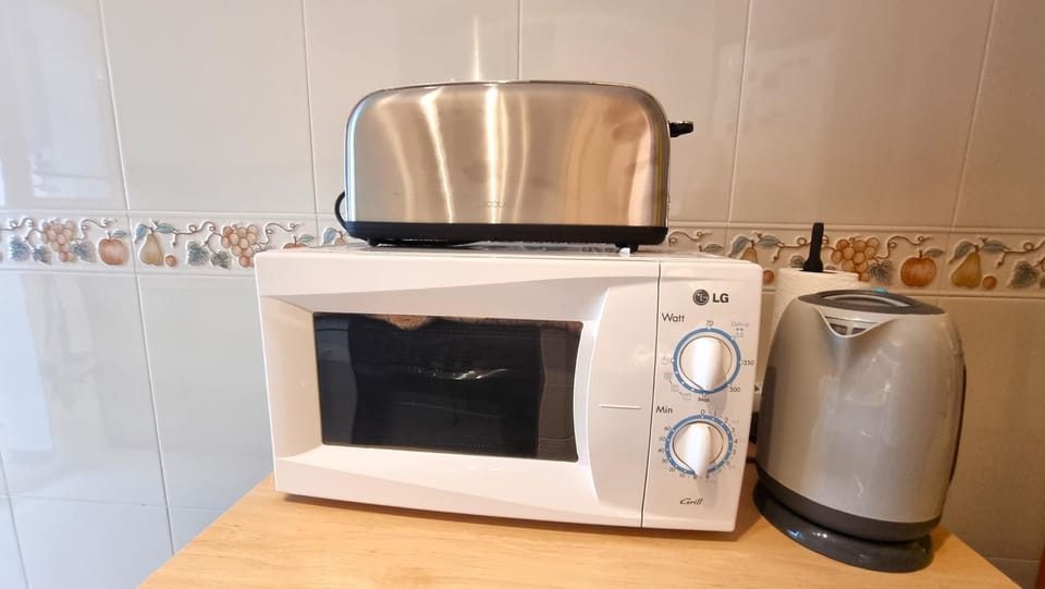 Kitchen or kitchenette, microwave, toaster