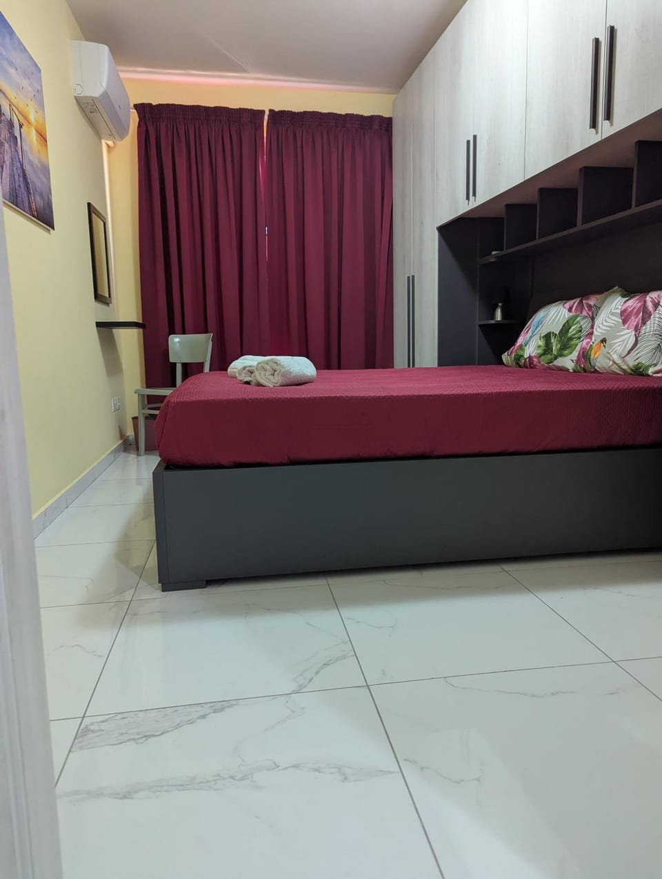 Bed, Photo of the whole room, Bedroom, hair dryier, towels, air conditioner
