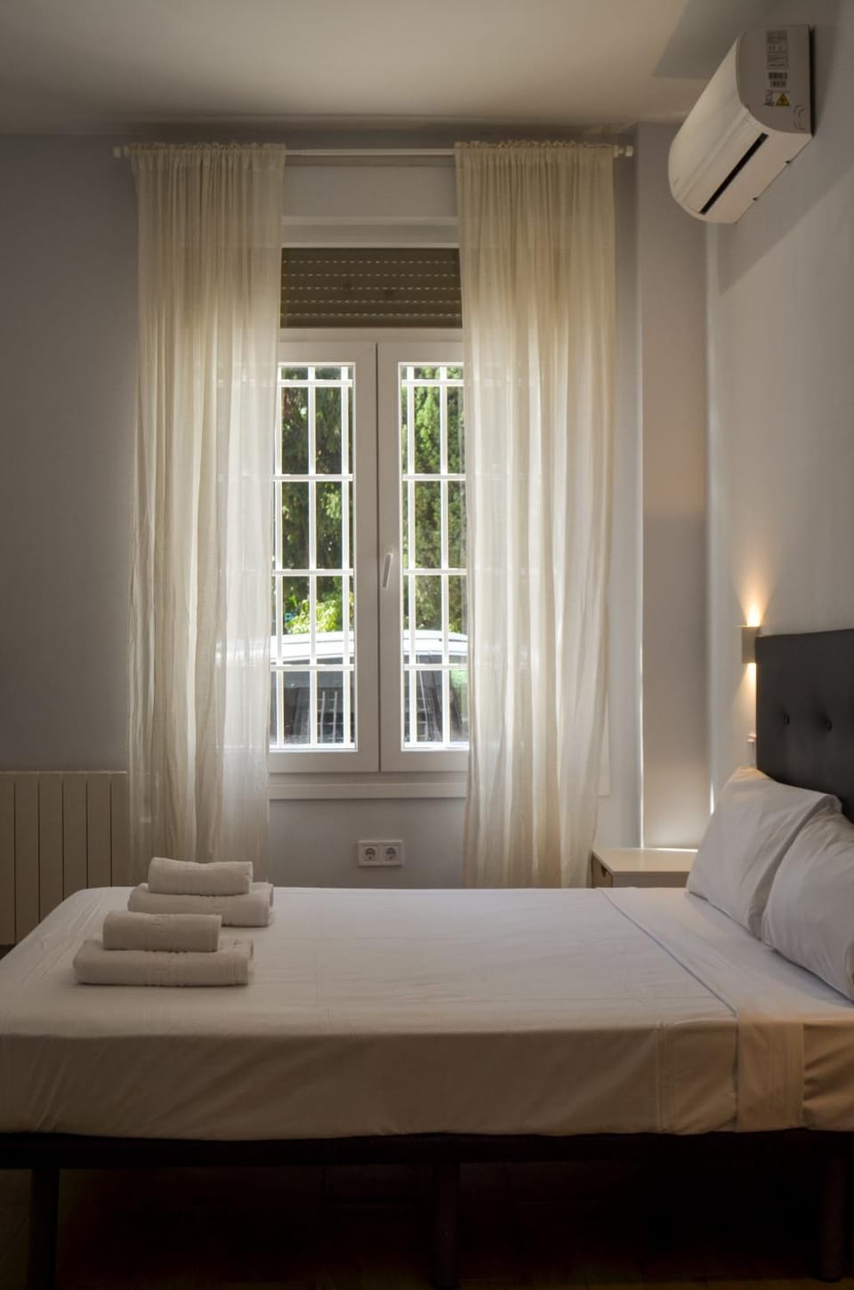 Bed, Photo of the whole room, Bedroom, towels, air conditioner