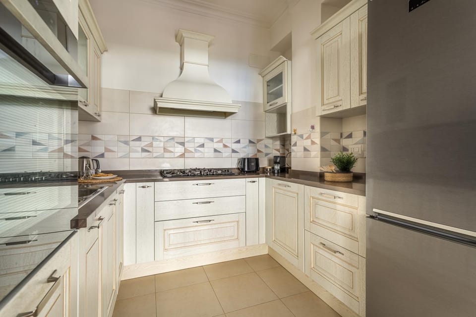 Kitchen or kitchenette, dishwasher, oven, stove