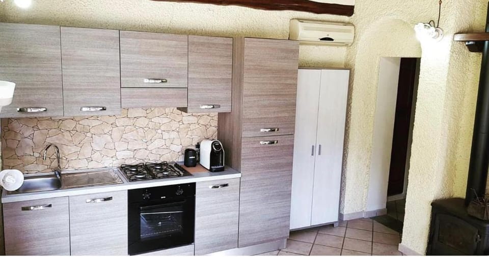 Kitchen or kitchenette, oven, stove, air conditioner