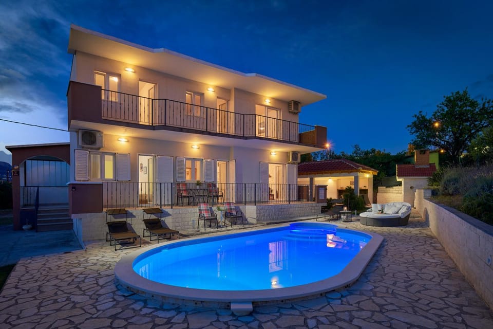 Property building, Patio, Night, Natural landscape, Pool view, Swimming pool, sunbed