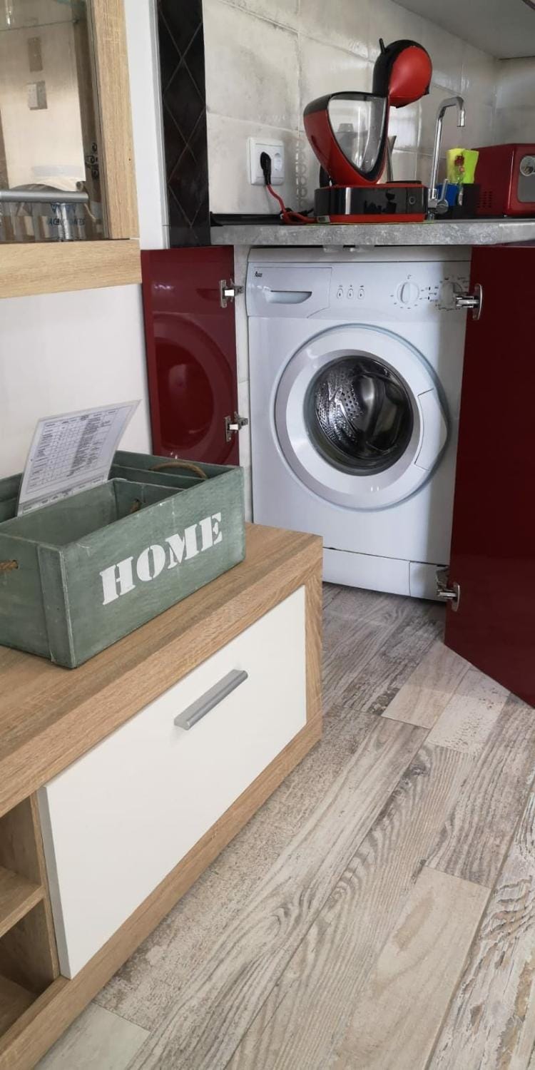Kitchen or kitchenette, washing machine
