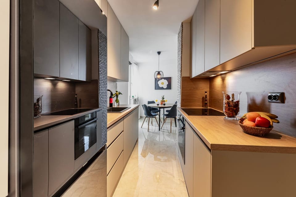 Kitchen or kitchenette, dishwasher, oven, stove