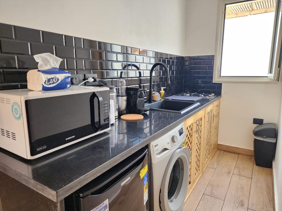 Coffee/tea facilities, Kitchen or kitchenette, minibar, stove, toaster, washing machine